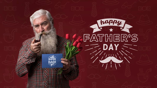 Free Father Holding Cardboard Mock-Up And Flowers On Burgundy Background Psd