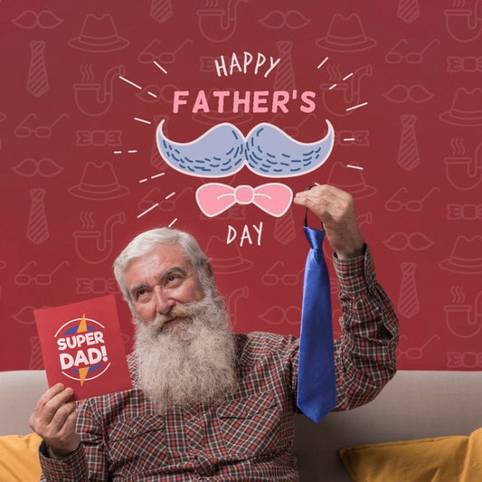 Free Father Holding Tie And Cardboard Mock-Up On Burgundy Background Psd