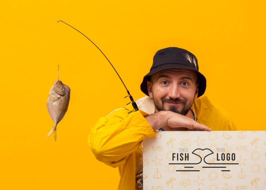 Free Fisherman In Raincoat Mock-Up And Fish Psd