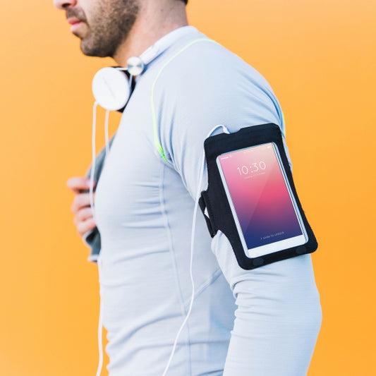 Free Fitness Mockup With Man With Smartphone On Arm Psd