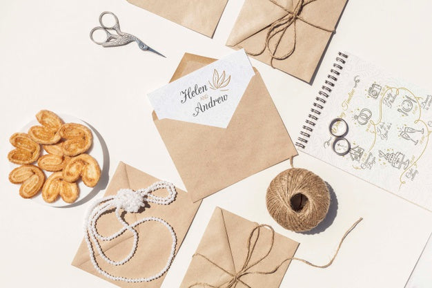 Free Flat Lay Arrangement Of Brown Paper Envelopes And Wedding Rings Psd