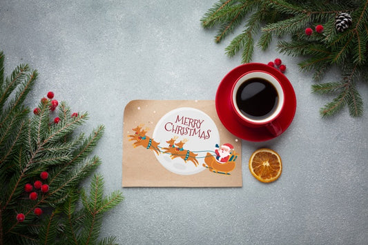 Free Flat Lay Cup Of Coffee With With Merry Christmas Letter And Pine Leaves Psd