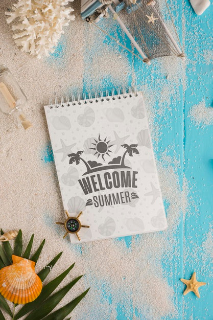 Free Flat Lay Notepad And Sand On The Table Psd