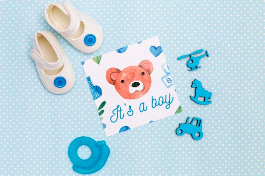 Free Flat Lay Of Blue Baby Shower Decorations With Shoes Psd