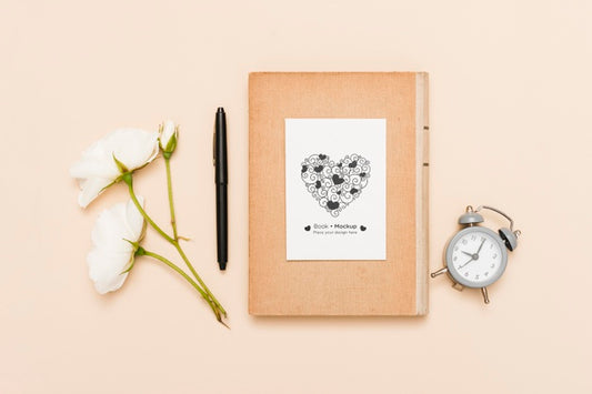 Free Flat Lay Of Book With Clock And Roses Psd