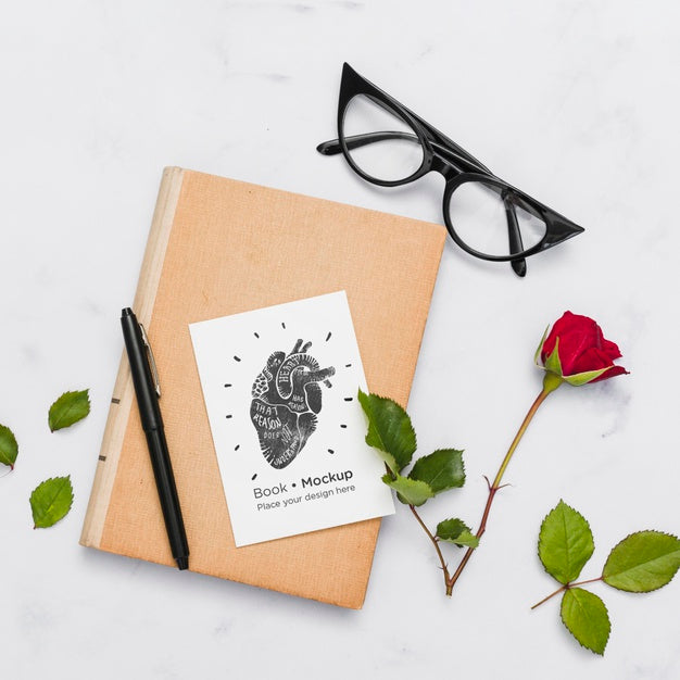 Free Flat Lay Of Book With Glasses And Rose Psd