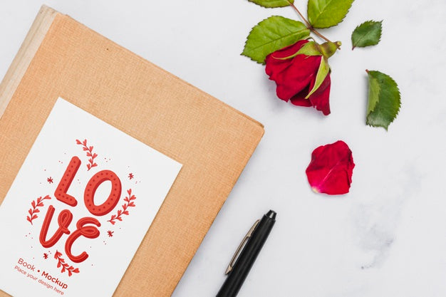 Free Flat Lay Of Book With Rose And Pen Psd