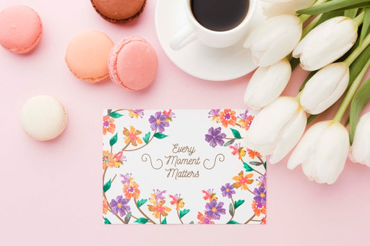 Free Flat Lay Of Card With Macarons And Tulips Psd