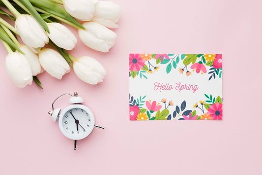 Free Flat Lay Of Card With Tulips And Clock Psd