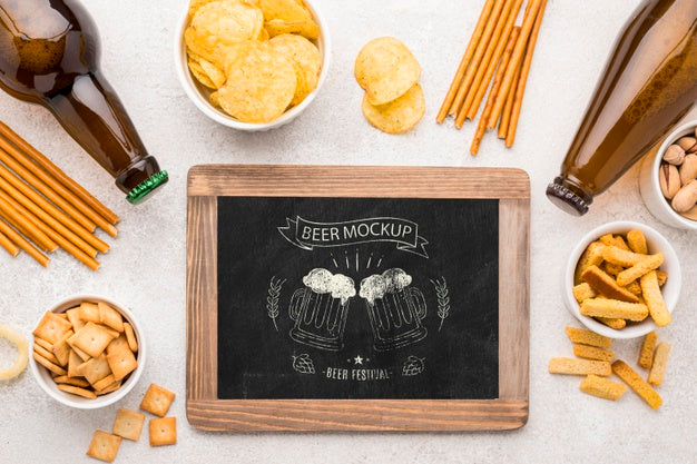 Free Flat Lay Of Chalkboard With Beer Bottles And Assortment Of Snacks Psd
