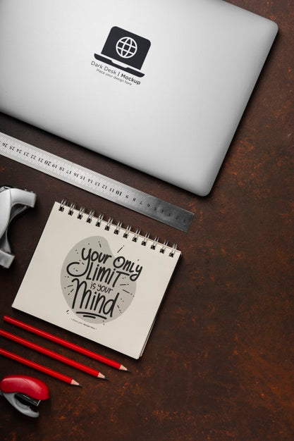 Free Flat Lay Of Desk Surface With Laptop And Pencils Psd