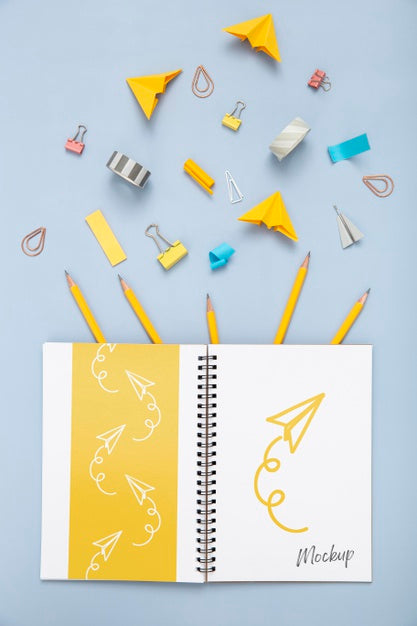 Free Flat Lay Of Desk Surface With Notebook And Essentials Psd