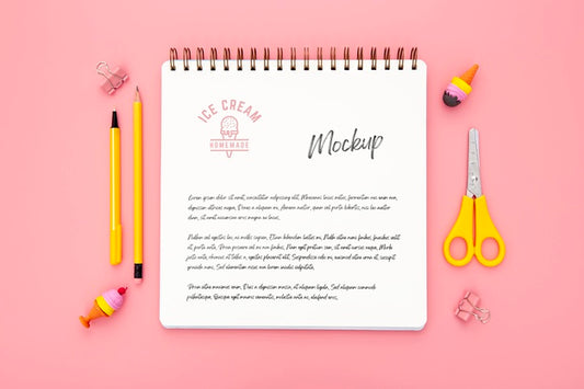Free Flat Lay Of Desk Surface With Notebook And Scissors Psd