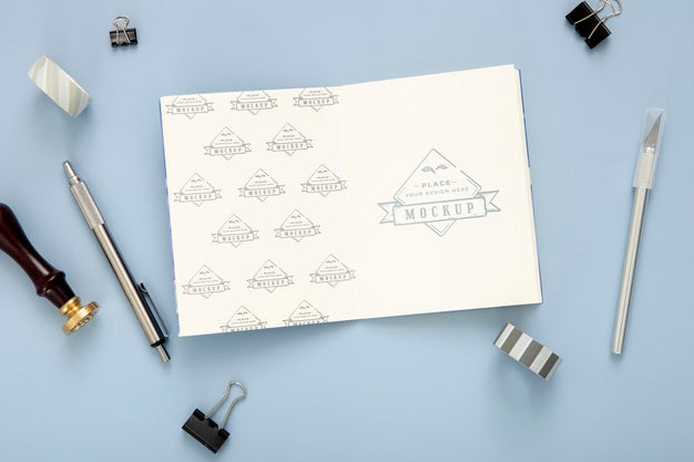 Free Flat Lay Of Desk Surface With Notepad And Pen Psd