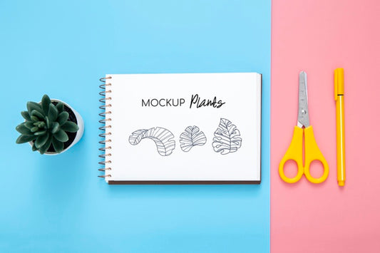 Free Flat Lay Of Desk Surface With Notepad And Scissors Psd