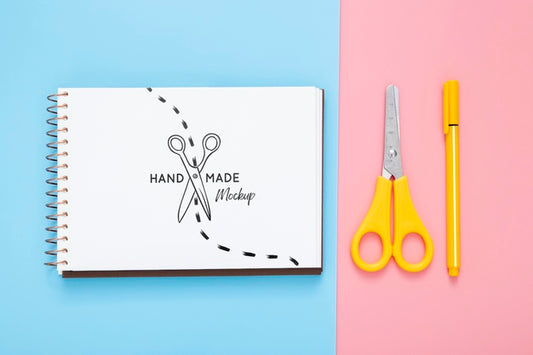 Free Flat Lay Of Desk Surface With Scissors And Pen Psd