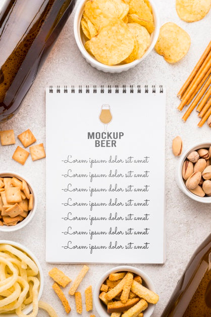 Free Flat Lay Of Notebook With Assortment Of Snacks And Beer Bottles Psd