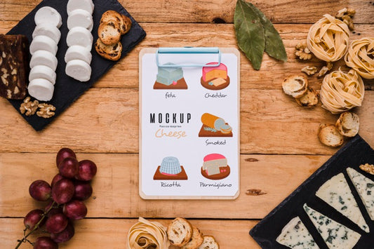 Free Flat Lay Of Notepad With Variety Of Cheese And Grapes Psd