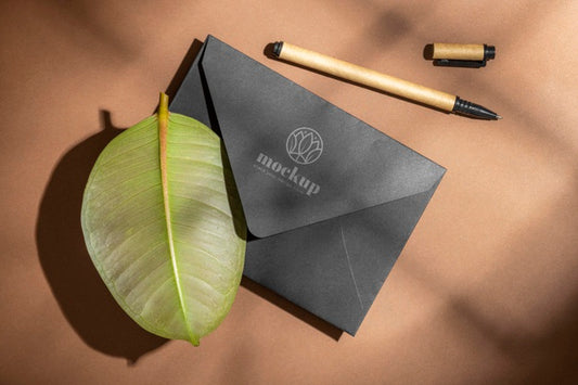 Free Flat Lay Of Paper Stationery With Pencil And Leaf Psd