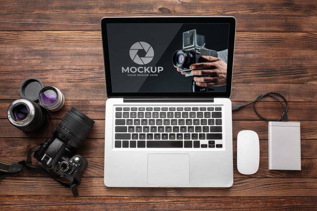 Free Flat Lay Of Photographer Wooden Workspace With Laptop Psd