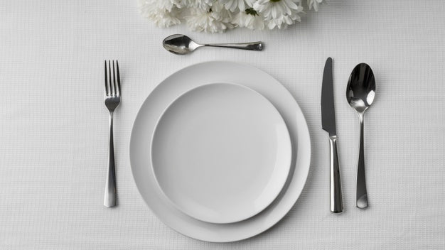 Free Flat Lay Of Plates On Table With Cutlery And Flowers Psd