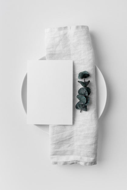 Free Flat Lay Of Table Arrangement With Spring Menu Mock-Up And Towel On Plate Psd