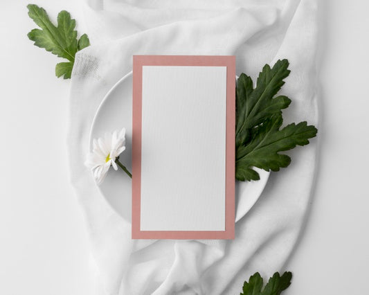 Free Flat Lay Of Table Arrangement With Spring Menu Mock-Up On Plate And Flower Psd