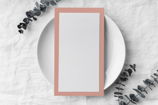 Free Flat Lay Of Table Arrangement With Spring Menu Mock-Up On Plate And Leaves Psd