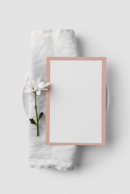 Free Flat Lay Of Table Arrangement With Spring Menu Mock-Up On Towel And Flower Psd