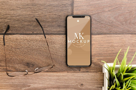 Free Flat Lay Smartphone Mock-Up With Glasses On Desk Psd
