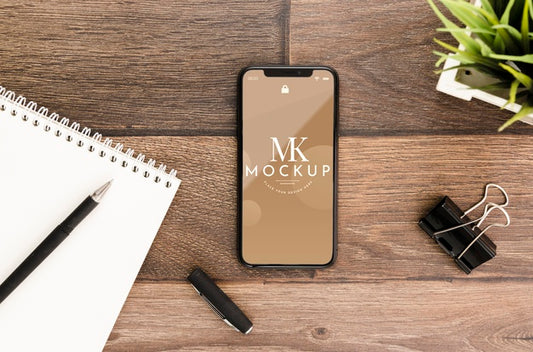 Free Flat Lay Smartphone Mock-Up With Motepad On Desk Psd