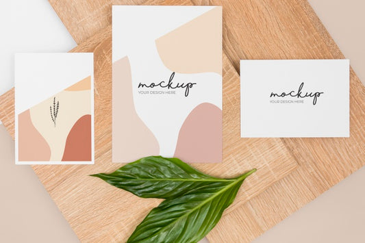 Free Flat Lay Stationery Leaves And Wooden Piece Psd