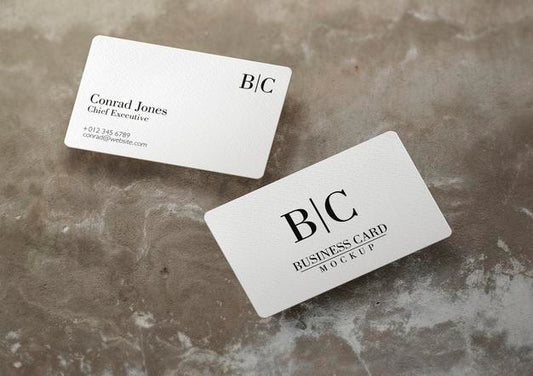Free Floating Business Card Over Concrete Surface Mockup Psd