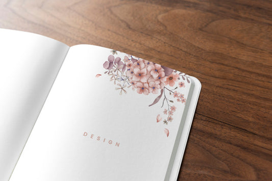 Free Floral Notebook Mockup On A Wooden Table Psd