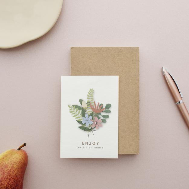Free Floral Postcard Mockup On A Pink Surface Psd