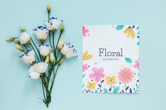 Free Flowers And Greeting Card On Table Psd