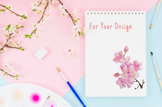 Free Flowers Beside Notebook With Realistic Draw Psd