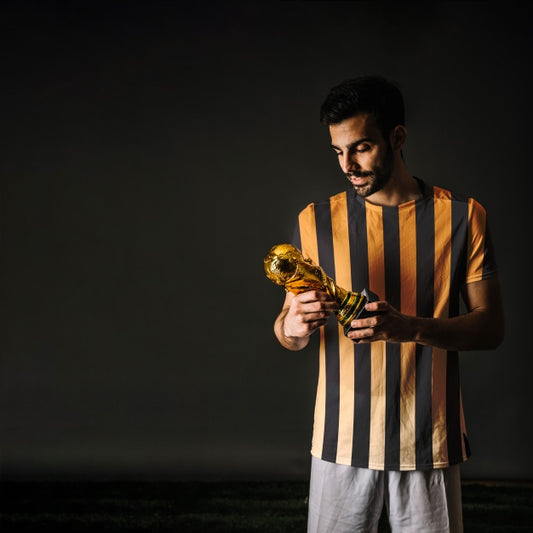Free Football Player Looking At Trophy Psd
