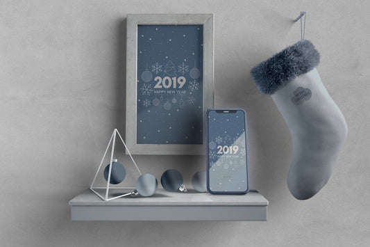 Free Frame And Sock On Wall Above Shelf With Phone Psd