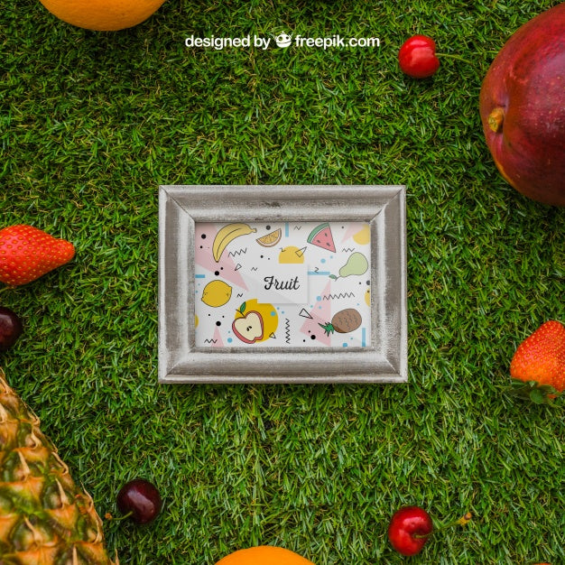 Free Frame And Tropical Fruits On Grass Psd