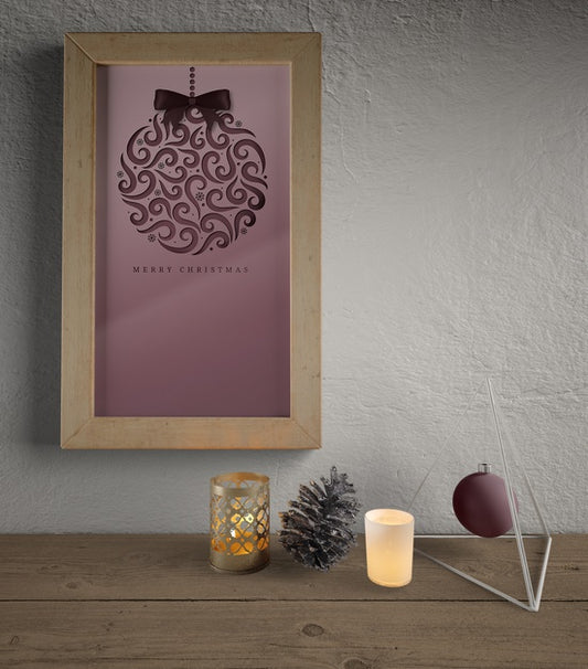 Free Frame Hooked On Wall With Christmas Decorations Under Psd