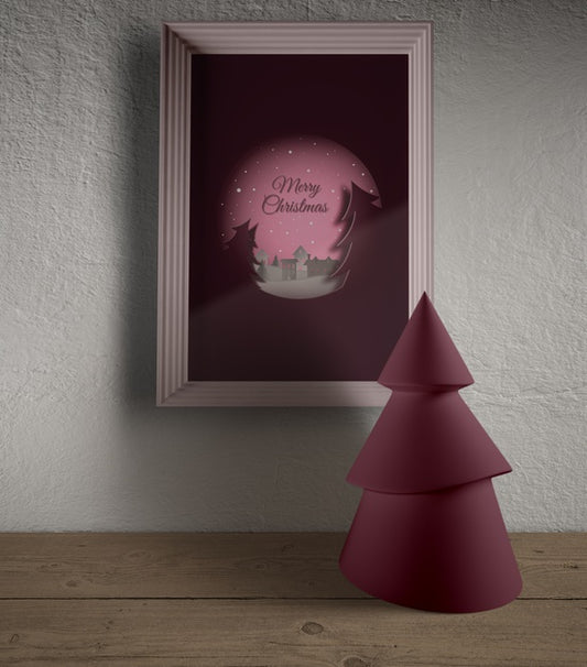 Free Frame Hooked On Wall With Miniature Christmas Tre Psd