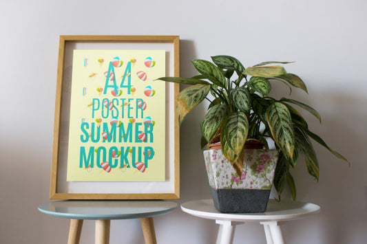 Free Frame Mockup On Table With Plant Psd