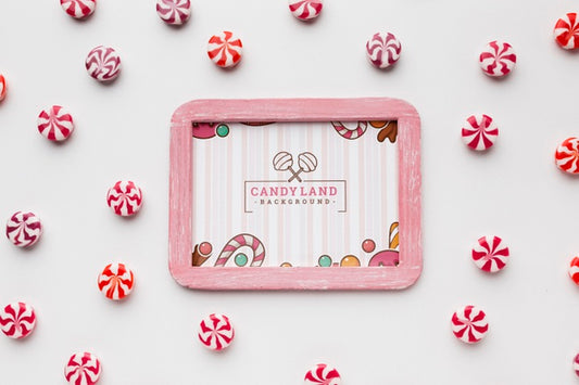 Free Frame With Candies Beside Psd