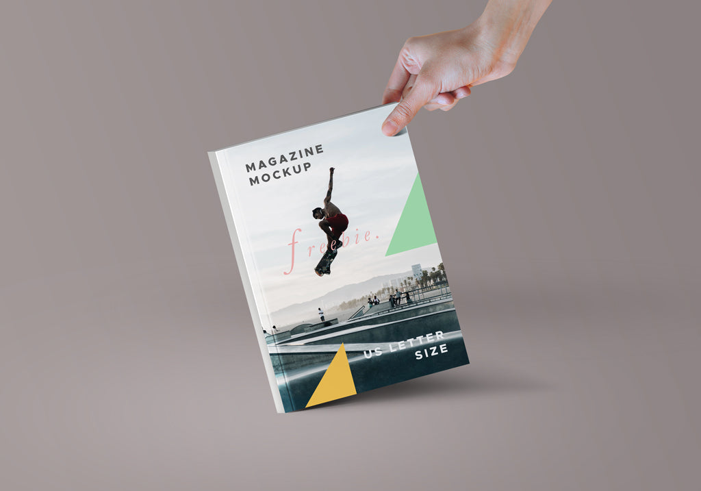 Free Hand holding Paper or Magazine PSD Mockup