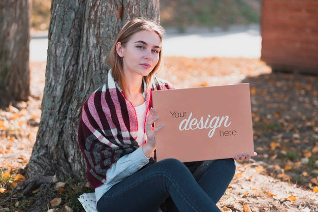 Free Front View Beautiful Blonde Girl Holding A Banner Mock-Up Psd