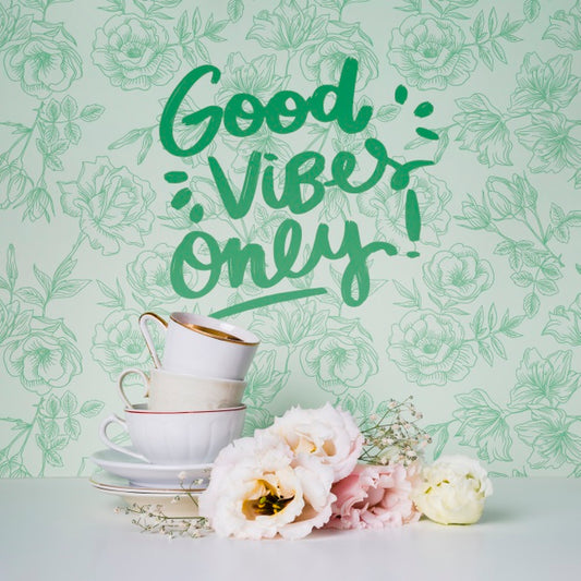 Free Front View Cups And Flowers With Motivational Quote Psd