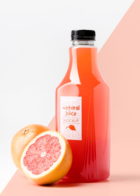Free Front View Glass Juice Bottle With Grapefruits Psd