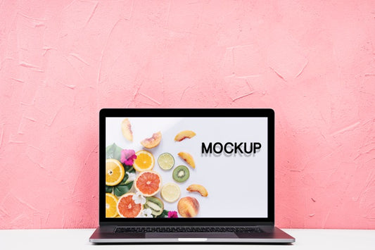 Free Front View Mock-Up Laptop With Pink Background Psd