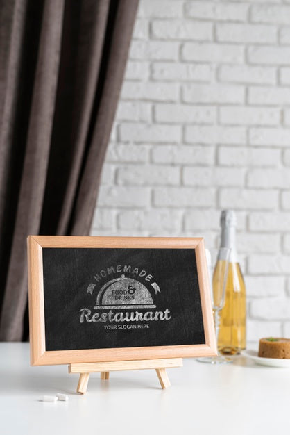 Free Front View Of Blackboard With Wine Bottle Psd